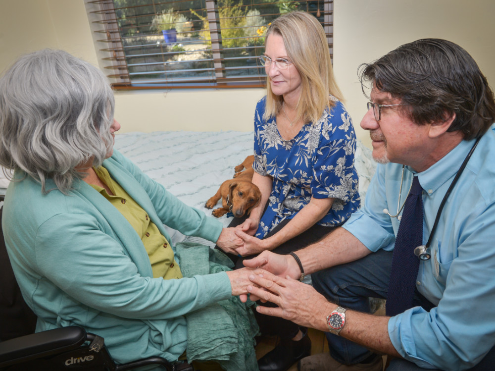 Lori and Doctor with Resident at Casas Adobes Assisted Living